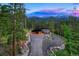 Mountain home with driveway and landscaping at 133 Adams Way, Breckenridge, CO 80424