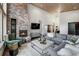 Spacious living room with a cozy fireplace and large windows at 133 Adams Way, Breckenridge, CO 80424
