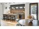Modern bar with stone backsplash and wine cooler at 72 Dyer Trl, Breckenridge, CO 80424