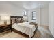Bright bedroom with a queen bed and ample natural light at 72 Dyer Trl, Breckenridge, CO 80424