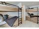 Room with two built-in bunk beds and ample storage at 72 Dyer Trl, Breckenridge, CO 80424