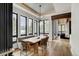 Bright dining room with a large table, modern chandelier, and scenic views at 72 Dyer Trl, Breckenridge, CO 80424
