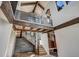 Grand entryway with a floating staircase and stone wall at 72 Dyer Trl, Breckenridge, CO 80424