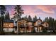 Luxury mountain home with expansive windows and a large deck at 72 Dyer Trl, Breckenridge, CO 80424