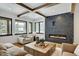 Living room with a modern fireplace and large windows at 72 Dyer Trl, Breckenridge, CO 80424