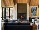Spacious living room with a large stone fireplace and high ceilings at 72 Dyer Trl, Breckenridge, CO 80424