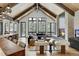 Spacious living room with a cozy fireplace and large windows offering scenic views at 72 Dyer Trl, Breckenridge, CO 80424