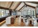 Open floor plan with kitchen, living area, and dining space with vaulted ceiling at 72 Dyer Trl, Breckenridge, CO 80424