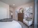 Secondary bedroom with ample closet space and stylish dresser at 5172 N Quemoy Ct, Aurora, CO 80019