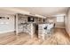 Basement bar with stone and wood features, and seating at 7892 S Country Club Pkwy, Aurora, CO 80016