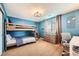 Blue bedroom with a bunk bed and built-in desk at 7892 S Country Club Pkwy, Aurora, CO 80016
