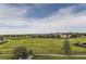 Open green space and neighborhood homes at 7892 S Country Club Pkwy, Aurora, CO 80016