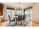 Spacious dining room with a large table and access to a deck at 7892 S Country Club Pkwy, Aurora, CO 80016