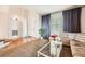 Bright living room featuring hardwood floors and a cozy seating area at 7892 S Country Club Pkwy, Aurora, CO 80016