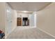 Finished basement with carpet, built-in shelving, and TV stand at 10073 Blackbird Pl, Highlands Ranch, CO 80130