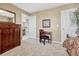 Bright bedroom with a desk and built-in wooden cabinet at 10073 Blackbird Pl, Littleton, CO 80130