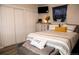 Cozy bedroom with double bed, built-in closet, and TV at 268 Belford Dr, Northglenn, CO 80260