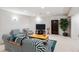 Finished basement with a seating area, TV, and plenty of space for entertaining at 4756 E Pinewood Cir, Centennial, CO 80121