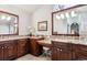 Elegant bathroom with dual vanities, granite countertops, and a large soaking tub at 4756 E Pinewood Cir, Centennial, CO 80121
