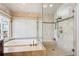 Spa-like bathroom featuring a walk-in shower and a soaking tub at 4756 E Pinewood Cir, Centennial, CO 80121