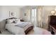 Charming bedroom with a classic wooden bed frame and window seating at 4756 E Pinewood Cir, Centennial, CO 80121