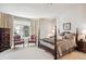 Spacious primary bedroom with ample natural light and a comfortable sitting area at 4756 E Pinewood Cir, Centennial, CO 80121