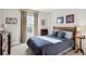 Bright and cheerful bedroom with a wooden bed frame and plenty of closet space at 4756 E Pinewood Cir, Centennial, CO 80121