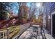Deck with table and chairs overlooking backyard at 4756 E Pinewood Cir, Centennial, CO 80121