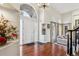 Elegant entryway with hardwood floors and a view into the living room at 4756 E Pinewood Cir, Centennial, CO 80121