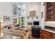 Gathering room features a fireplace and wall of windows at 4756 E Pinewood Cir, Centennial, CO 80121