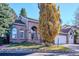 Brick house with two-car garage and landscaping at 4756 E Pinewood Cir, Centennial, CO 80121