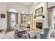 Spacious living room with fireplace and large windows at 4756 E Pinewood Cir, Centennial, CO 80121