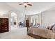 Main bedroom with a sitting area and access to a private bathroom at 4756 E Pinewood Cir, Centennial, CO 80121