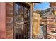 Front entrance with a security gate and brick wall at 11708 Elk Head Range Rd, Littleton, CO 80127