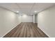 Finished basement with neutral walls and vinyl flooring at 1059 S Saulsbury St, Lakewood, CO 80226