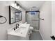 Clean basement bathroom with a modern shower and vanity at 1059 S Saulsbury St, Lakewood, CO 80226