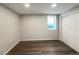 Spacious finished basement room with hardwood floors and a large closet at 1059 S Saulsbury St, Lakewood, CO 80226