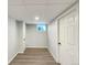 Finished basement room with vinyl flooring and a window at 1059 S Saulsbury St, Lakewood, CO 80226