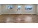 Bright living room featuring hardwood floors and large windows at 1059 S Saulsbury St, Lakewood, CO 80226