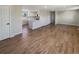 Open concept living room with hardwood floors and kitchen views at 1059 S Saulsbury St, Lakewood, CO 80226