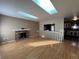 Spacious living room with hardwood floors, fireplace and skylights at 15503 E Princeton Ave, Aurora, CO 80013
