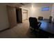 Finished basement room features a workspace with desk and chair, plus additional closet storage at 15503 E Princeton Ave, Aurora, CO 80013
