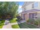 Two-story townhome with landscaping and walkway at 22580 E Ontario Dr # 103, Aurora, CO 80016