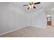 Spacious bedroom with ceiling fan and neutral carpeting at 22580 E Ontario Dr # 103, Aurora, CO 80016