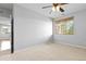 Well-lit bedroom with ceiling fan and window at 22580 E Ontario Dr # 103, Aurora, CO 80016