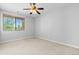 Bright bedroom with ceiling fan and window at 22580 E Ontario Dr # 103, Aurora, CO 80016