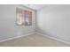 Simple bedroom with window and neutral decor at 22580 E Ontario Dr # 103, Aurora, CO 80016