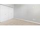 Bedroom with double-door closet and neutral walls at 22580 E Ontario Dr # 103, Aurora, CO 80016