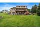 Two-story house with large deck and backyard at 5861 E Valley Hi Dr, Parker, CO 80138