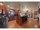Modern kitchen with island, stainless steel appliances, and hardwood floors at 5861 E Valley Hi Dr, Parker, CO 80138